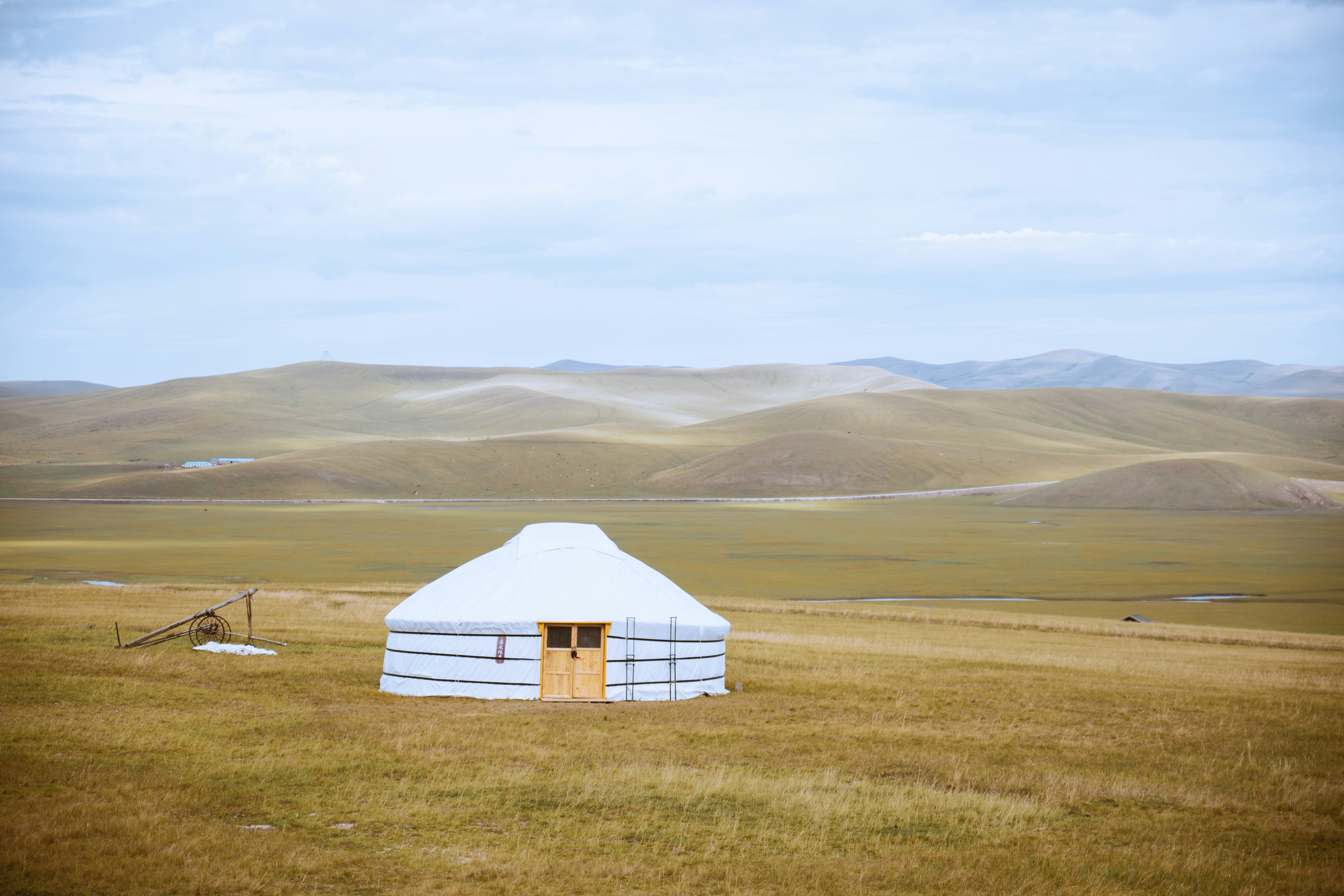 Ger (yurt) on open steppe with mountains